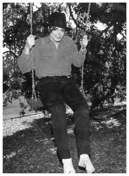 Michael on the swing at Neverland.