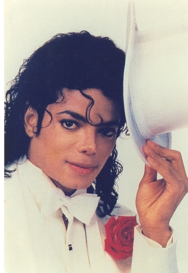 Michael holding a white hat