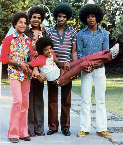 Michael goofing around with his brothers.